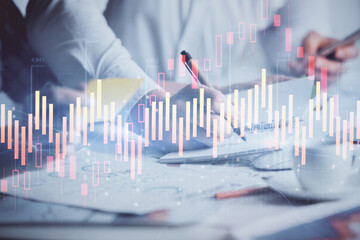 Double exposure of forex graph drawing over people taking notes background. Concept of financial analysis