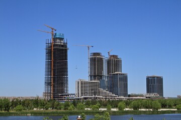 Skyscraper buildings under construction on the lake shore in China