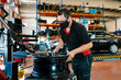 © Ezequiel Gimenez/Westend61 - Mechanic wearing mask while working in auto repair shop