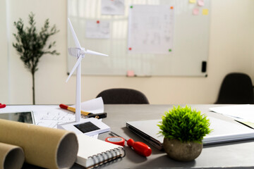 Wind turbine shaped electric fan standing on office desk