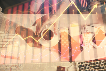 Double exposure of man and woman working together and financial chart hologram drawing. market analysis concept. Computer background. Top View.