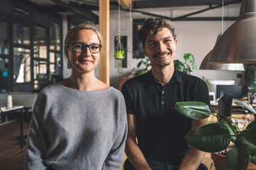 Portrait of smiling computer programmers at workplace