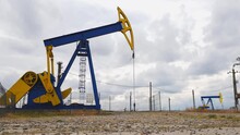 Mechanical Oil Well Pumpjacks At An Oil Field Near Ploiesti, Romania