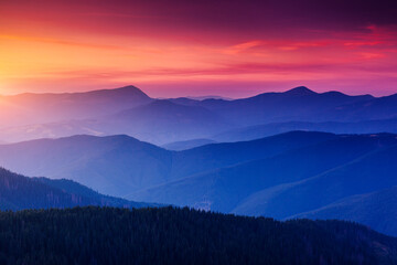 Wall Mural - Pictorial mountains are illuminated by the evening light.