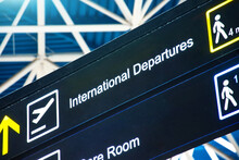 Directions On The Sign At The Airport - International Departures.