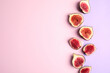 Delicious ripe figs on color background, flat lay. Space for text