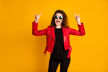 Poster - Portrait of her she nice attractive cheerful crazy cool wavy-haired girl showing two horn symbol having fun isolated on bright yellow color background