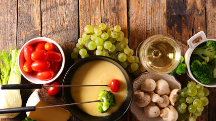 Wall Mural - cheese fondue with fresh vegetable selection