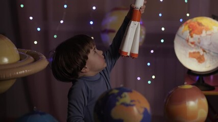 Wall Mural - Space Travel Spaceship. Creative Little Kid Boy Astronaut Launching Rocket From Spaceport Through Planets. Child Dreamer Playing Toy Space Rocket Flying Among Planets. Spaceman Fantasy Flying on Space