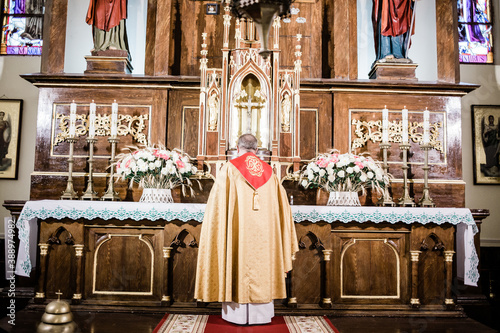 Cuadros en Lienzo a catalytic priest at the altar in the interior of the church