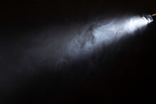 Spotlight, Ray Of Light On Smoke. Black Backround