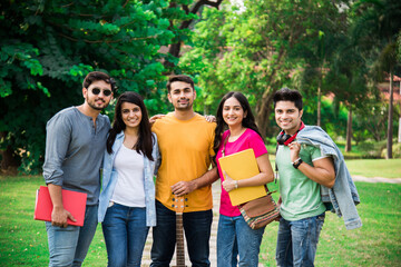 Wall Mural - Education is fun - Cheerful Indian asian young students enjoying togetherness in college campus