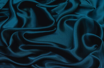 Wall Mural - Smooth elegant blue silk satin fabric texture  as abstract background. Luxurious pattern for design.