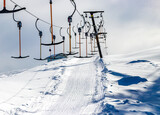 Fototapeta Na ścianę - Drag lift no people, ski resort closed. Concept: pandemic, lockdown, covid-19