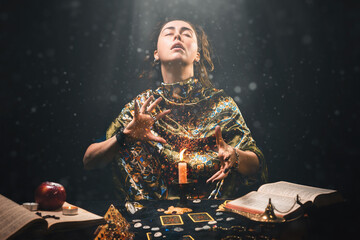 Canvas Print - astrology and divination. portrait of a fortune teller who reads by candle, eyes closed in ecstasy. 