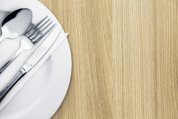 Canvas Print - Silverware. Fork, spoon and knife on the plate