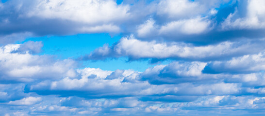 Wall Mural - Bright blue sky with miles of big puffy clouds