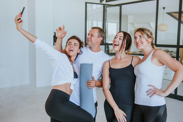 Smiling young people having fun making selfie photo