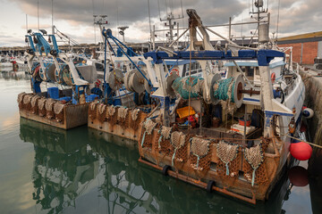 Rusty boat and nets for catching scallops