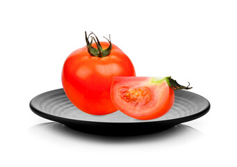 Wall Mural - Ripe tomatoes in black plate on white background