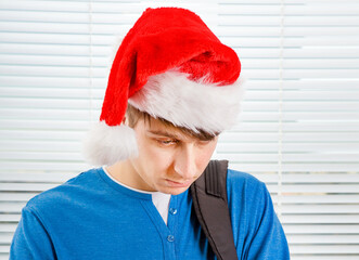 Canvas Print - Sad Young Man in Santa Hat