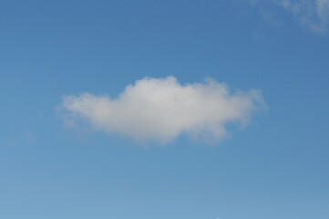 a light cloud in the blue spring sky.