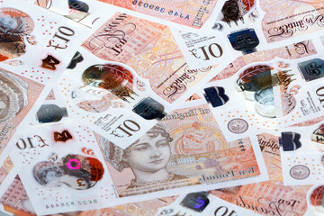 Wall Mural - Heap of ten pound banknotes - British Currency concept. 