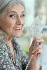 Sticker - Close-up portrait of elderly woman with flu inhalation