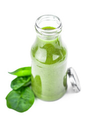 Wall Mural - Homemade spinach smoothie isolated on white (close up; selective focus)