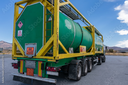 Tank container with dangerous goods, loaded with flammable solids and high temperature.
