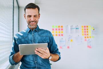 one businessman using digital tablet at office