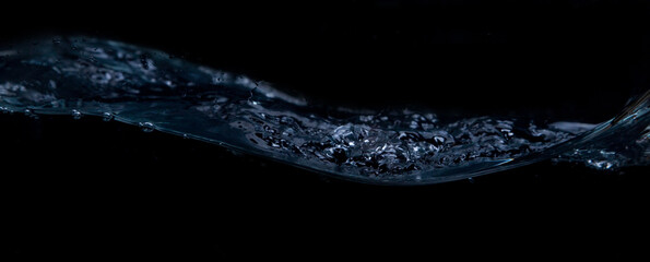 A wave on a black background