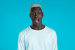 © kohanova1991 - African man depicts amazement, shows WOW delight face effect. Surprised excited happy guy. Handsome male shocked model on blue background.