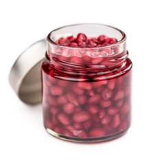 Canvas Print - Portion of preserved Pomegranate seeds isolated on white background (selective focus).