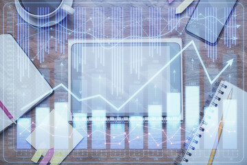 Double exposure of forex chart hologram over desktop with phone. Top view. Mobile trade platform concept.