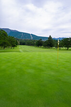 Golf Course With Beautiful Green Field. Golf Course With A Rich Green Turf Beautiful Scenery.