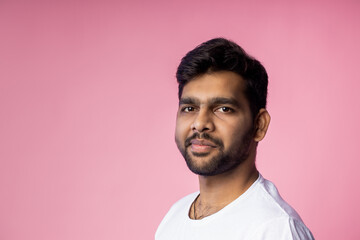 Sticker - Portrait of handsome Indian guy standing on pink background