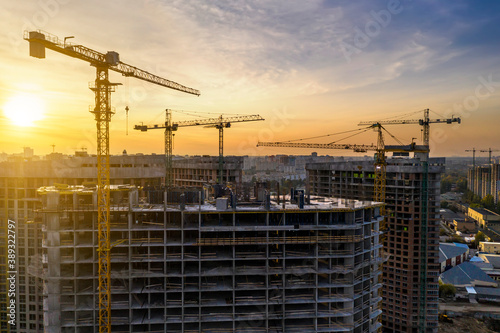 Cuadros en Lienzo Construction site with cranes at sunset