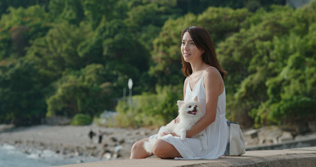 Poster - Woman enjoy sunset view with her dog