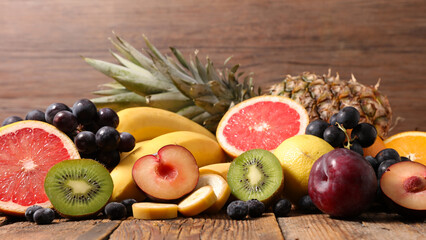  fresh fruit composition on wood background