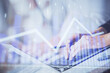 © peshkova - Double exposure of woman hands typing on computer and forex chart hologram drawing. Stock market invest concept.