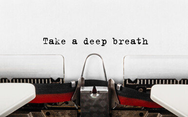 Poster - text take a deep breath typed on retro typewriter