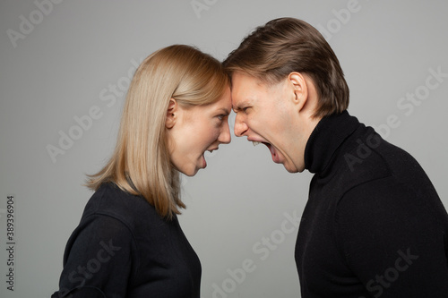 young beautiful couple man and woman in a quarrel