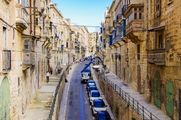 Wall Mural - Titel: Romantic little side or backstreet alley inside historic old town of Valletta, Malta, UNESCO world heritage site in the Mediterranean, popular with cruise tourists for ancient facades