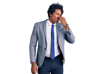 Wall Mural - Handsome african american man with afro hair wearing business jacket smelling something stinky and disgusting, intolerable smell, holding breath with fingers on nose. bad smell