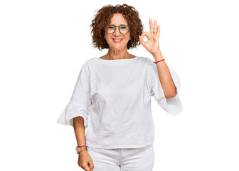 Sticker - Beautiful middle age mature woman wearing casual clothes and glasses smiling positive doing ok sign with hand and fingers. successful expression.