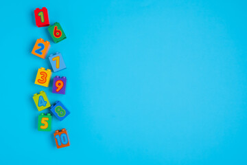 cubes with numbers of different colors on a blue background