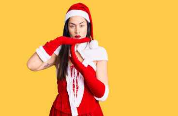 Poster - Young beautiful caucasian woman wearing santa claus costume doing time out gesture with hands, frustrated and serious face