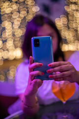 Poster - vertical portrait of woman using her mobile phone