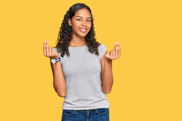 Canvas Print - Young african american girl wearing casual clothes doing money gesture with hands, asking for salary payment, millionaire business